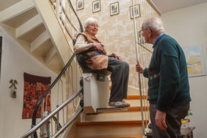 elderly couple at the stairlift