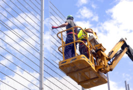 Hydraulic mobile construction platform pointed to sky with construction workers
