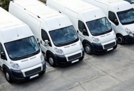 overhead of delivery vans parked in a row